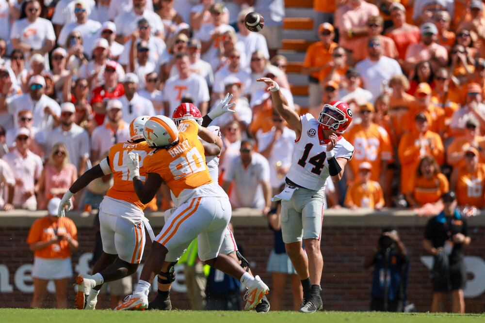 Georgia quarterback Gunner Stockton (14) attempts a long pass to Georgia wide receiver Colbie Young (not pictured) during the first quarter against Tennessee at Neyland Stadium, Saturday, September 13, 2025, in Knoxville, Tenn. (Jason Getz / AJC)