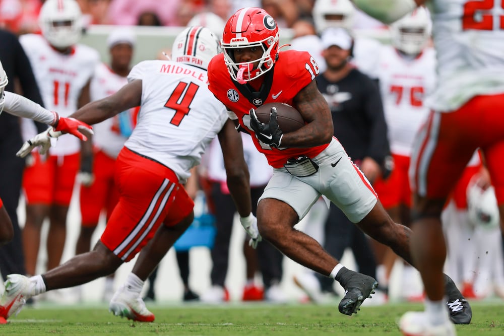 Georgia wide receiver Sacovie White-Helton (18) runs after a reception against Austin Peay linebacker Will Middleton (4) during the first half at Sanford Stadium, Saturday, September 6, 2025, in Athens, Ga. (Jason Getz / AJC)
