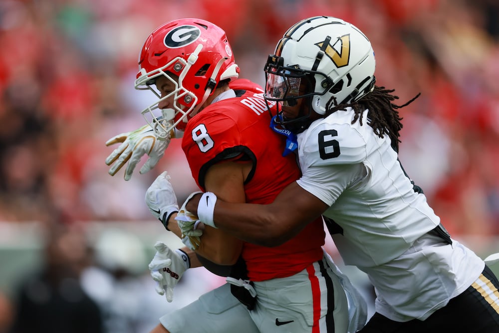 Georgia wide receiver Landon Roldan (8) makes a long reception against Vanderbilt cornerback Jordan Matthews (6) during the first quarter in their SEC football game at Sanford Stadium, Saturday, Oct. 3, 2026, in Athens, Ga. (Jason Getz/AJC)