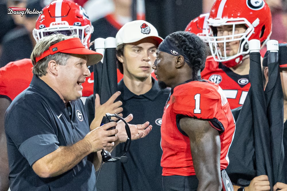 Georgia coach Kirby Smart (left) speaks with redshirt freshman cornerback Ellis Robinson IV after a key early play against Alabama on Saturday, Sept. 27, 2025, in Athens. (Jeff Sentell/DawgNation)