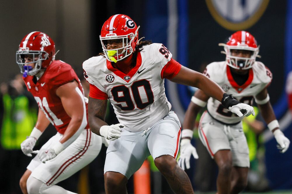 Georgia defensive lineman Elijah Griffin (90) reacts during a play against the Alabama offense during their NCAA football game in the SEC Championship game at Mercedes-Benz Stadium, Saturday, Dec. 6, 2025, in Atlanta. Georgia won 28-7. (Jason Getz / AJC)