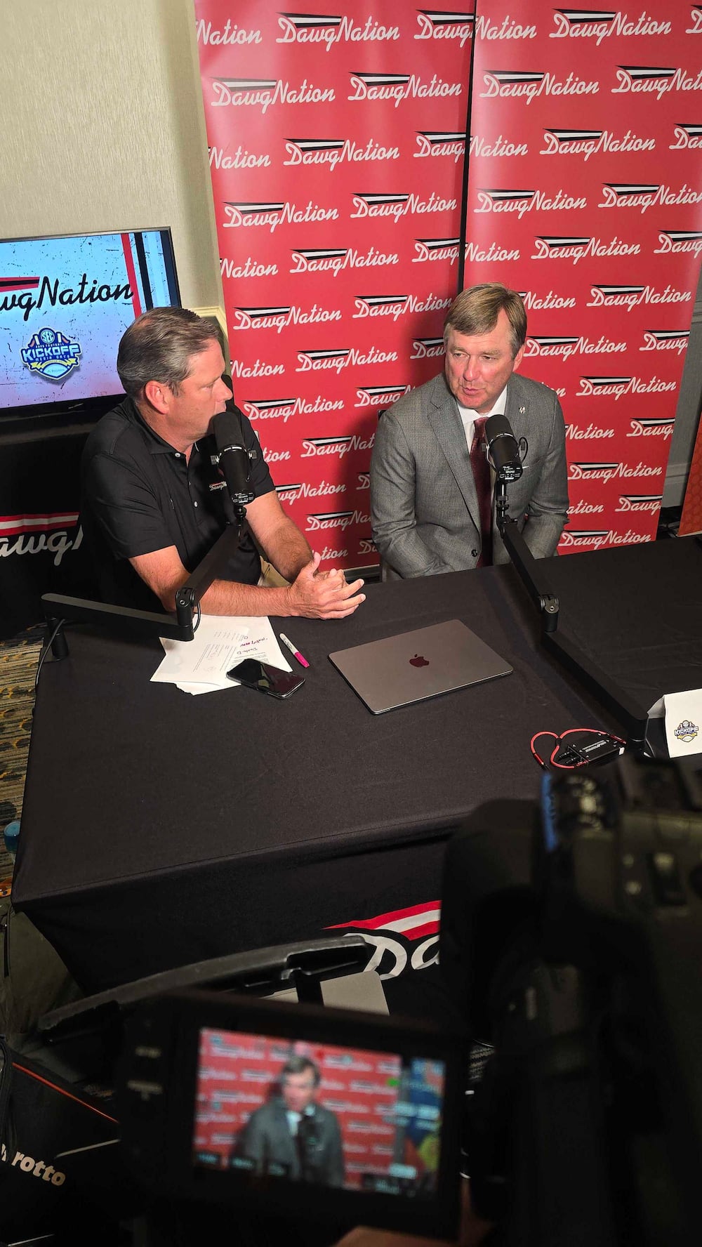 "DawgNation Daily" host Brandon Adams (left) interviews Georgia head coach Kirby Smart during the 2026 SEC media days. (Cody Chaffins/DawgNation)