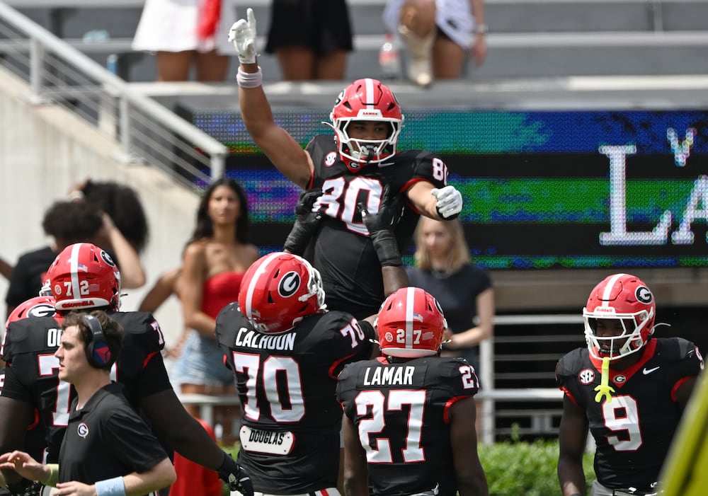Georgia tight end Kaiden Prothro (80) celebrates with teammates after scoring a touchdown during 2026 G-Day spring football game at Sanford Stadium, Saturday, April 18, 2026, in Athens. (Hyosub Shin/AJC)