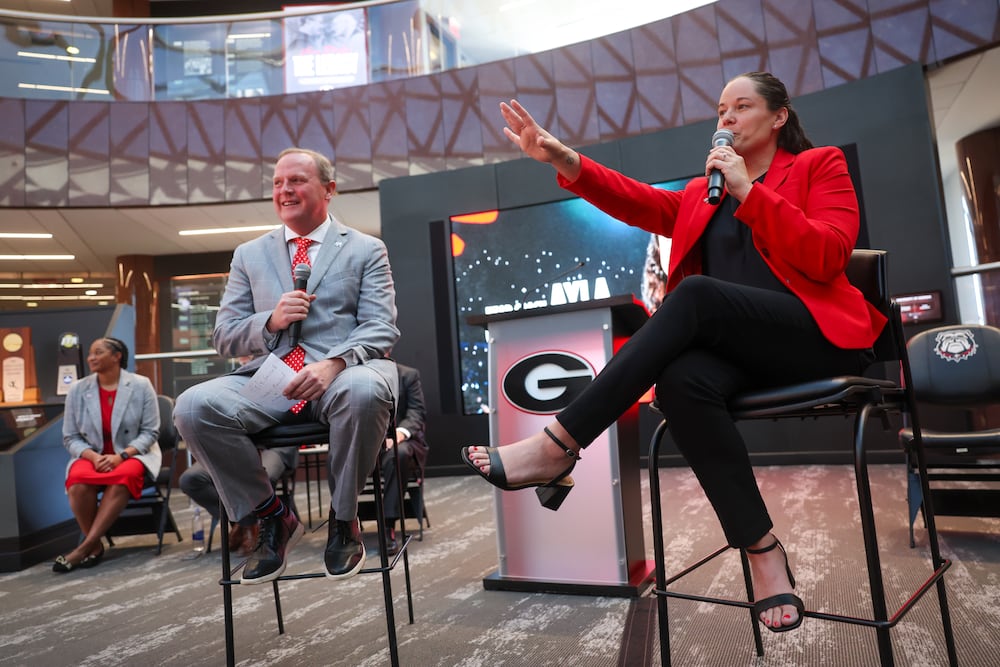 New University of Georgia women's basketball coach Ayla Guzzardo is joined by radio host Jeff Dantzler at an introductory news conference April 7, 2026. (Arvin Temkar/AJC)