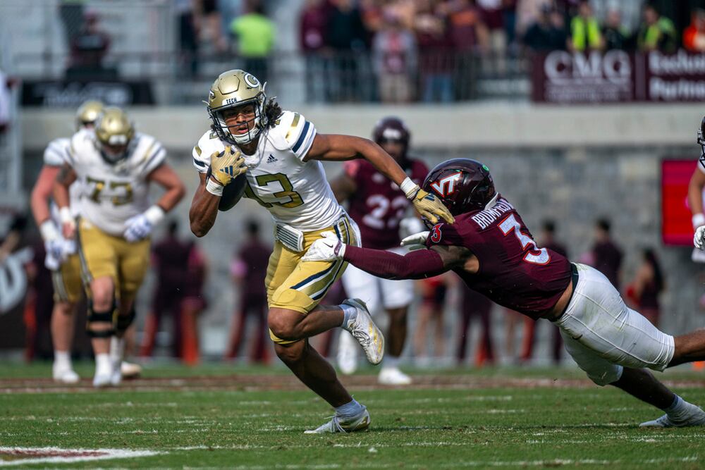Georgia Tech wide receiver Isiah Canion gets by Virginia Tech linebacker Sam Brumfield on Saturday, Oct. 26, 2024, in Blacksburg, Va. (Robert Simmons/AP)