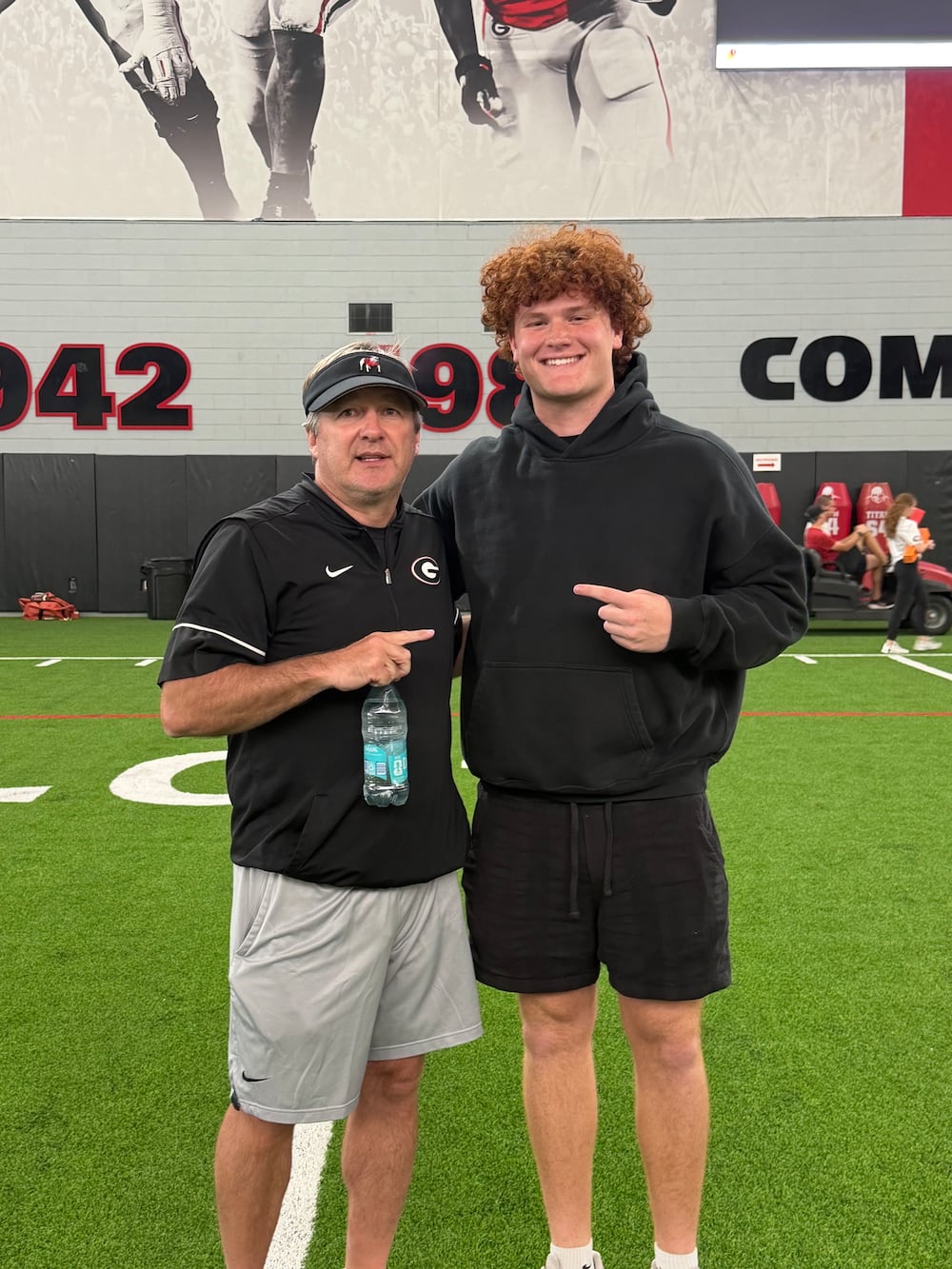 Five-star Class of 2028 edge prospect Asher Ghioto (right) has an interesting backstory with the Georgia football program. He was wearing a Georgia beanie within minutes of being born. He also wears No. 34 in honor of Georgia legend Herschel Walker. (Courtesy)
