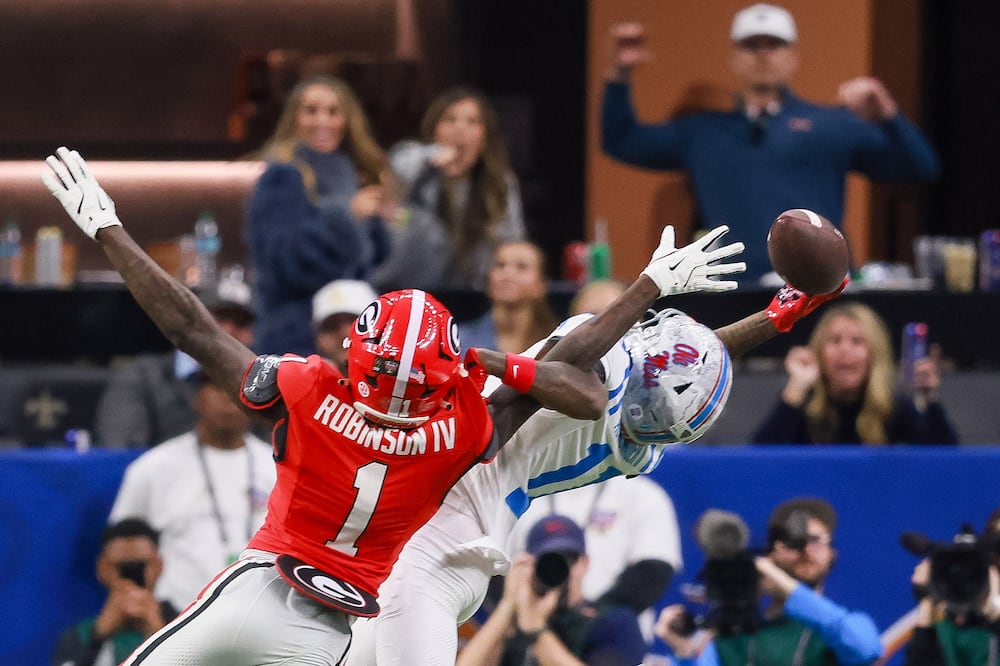 Georgia Bulldogs defensive back Ellis Robinson IV (left) blocks an attempted pass to Ole Miss Rebels wide receiver Deuce Alexander during the Sugar Bowl at the Caesars Superdome on Thursday, Jan. 1, 2026, in New Orleans. (Jason Getz/AJC)