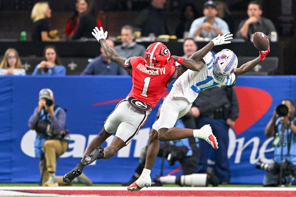 Georgia defensive back Ellis Robinson IV (left) blocks an attempted pass to Ole Miss wide receiver Deuce Alexander during the Sugar Bowl at the Caesars Superdome on Thursday, Jan. 1, 2026, in New Orleans. (Hyosub/AJC)