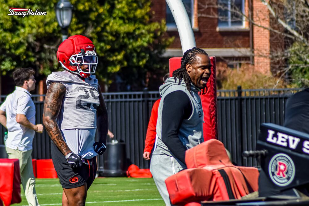 Georgia OLBs coach Larry Knight (right) runs drills with his players during the second day of spring practice on Thursday, March 19, 2026, in Athens. (DawgNation)