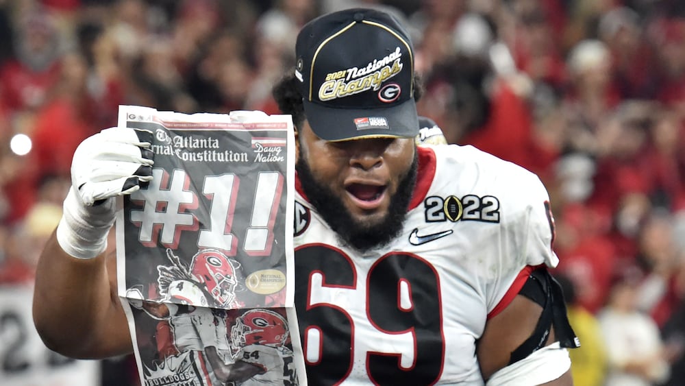 Georgia offensive lineman Jamaree Salyer celebrates after the Bulldogs beat Alabama to win the 2022 College Football Playoff national championship at Lucas Oil Stadium on Monday, Jan. 10, 2022, in Indianapolis. (Hyosub Shin/AJC)