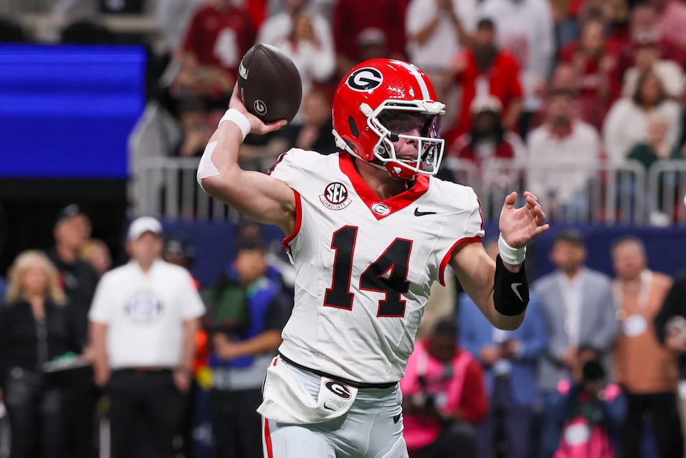 Georgia quarterback Gunner Stockton throws his first touchdown to Roderick Robinson II (not pictured) during their SEC championship game against Alabama at Mercedes-Benz Stadium on Saturday, Dec. 6, 2025, in Atlanta. (Jason Getz/AJC)