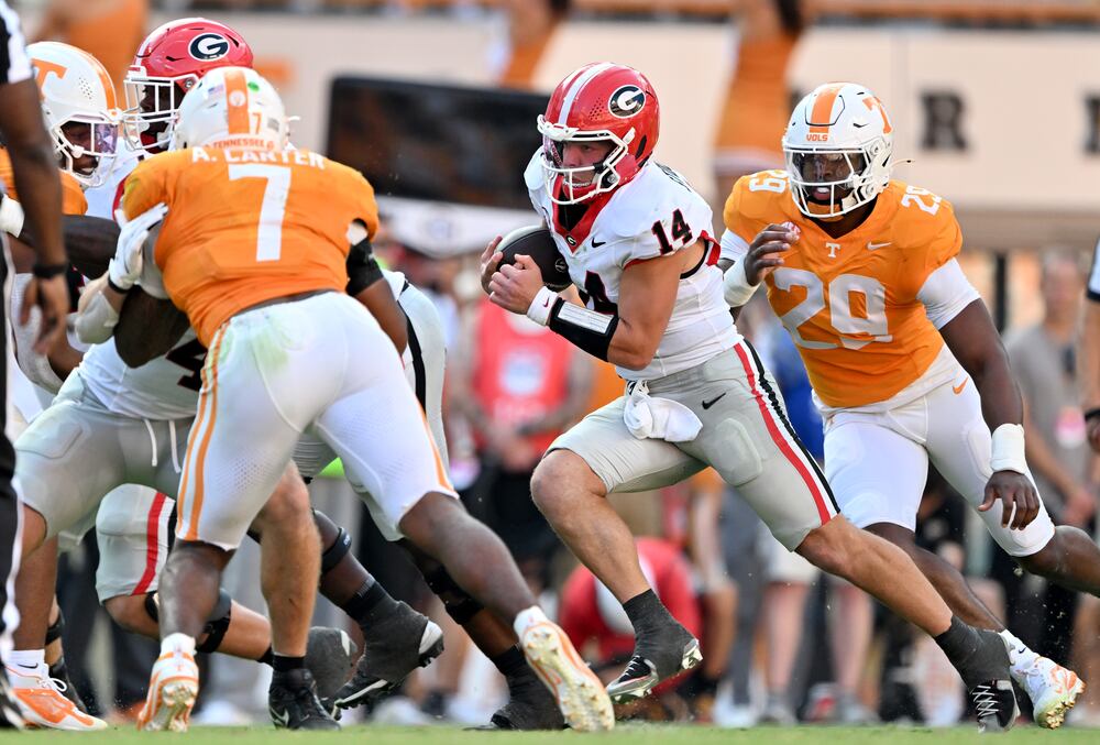 Georgia quarterback Gunner Stockton (14) runs with a ball during the second half in an NCAA football game at Neyland Stadium, Saturday, September 13, 2025, in Knoxville, Tenn. Georgia won 44-41 over Tennessee in overtime.