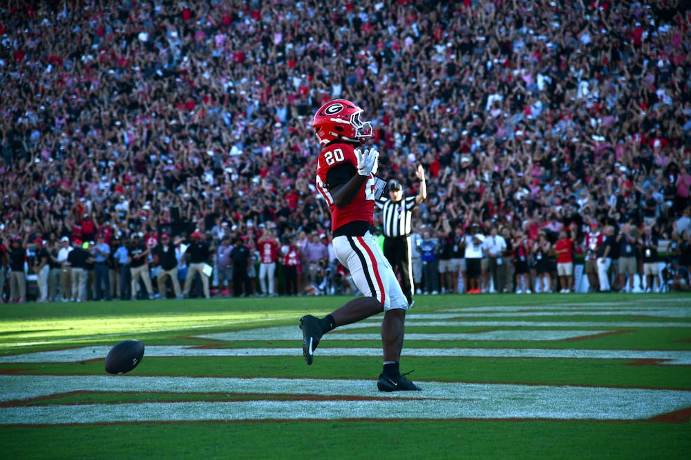 Georgia running back Dwight Phillips Jr. celebrates as he scores a touchdown during the second half Saturday, Sept. 26, 2026, at Sanford Stadium in Athens. (Hyosub Shin/AJC)