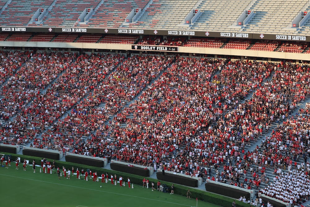 Soccer fans fill the seating section below the Dooley Field sign during the first half of the "Soccer in Sanford" match between Georgia and James Madison on Thursday, Aug. 20, 2026, in Athens. (Jason Getz/AJC)