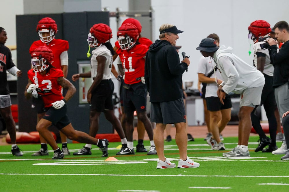 Georgia coach Kirby Smart (center, in black) gives instructions during the first fall football practice Wednesday, Aug. 5, 2026, at the practice facility in Athens. (Miguel Martinez/AJC)