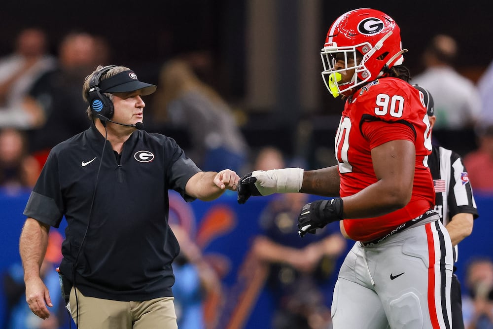 Georgia head coach Kirby Smart (left) greets defensive lineman Elijah Griffin during the Sugar Bowl inside the Caesars Superdome on Thursday, Jan. 1, 2026, in New Orleans. (Jason Getz/AJC)