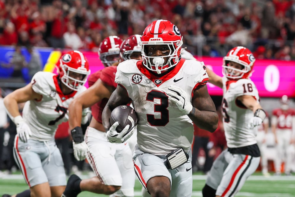 Georgia running back Nate Frazier (3) rushes for a nine yard touchdown against Alabama during the third quarter of the SEC Championship game at Mercedes-Benz Stadium, Saturday, Dec. 6, 2025, in Atlanta. (Jason Getz / AJC)