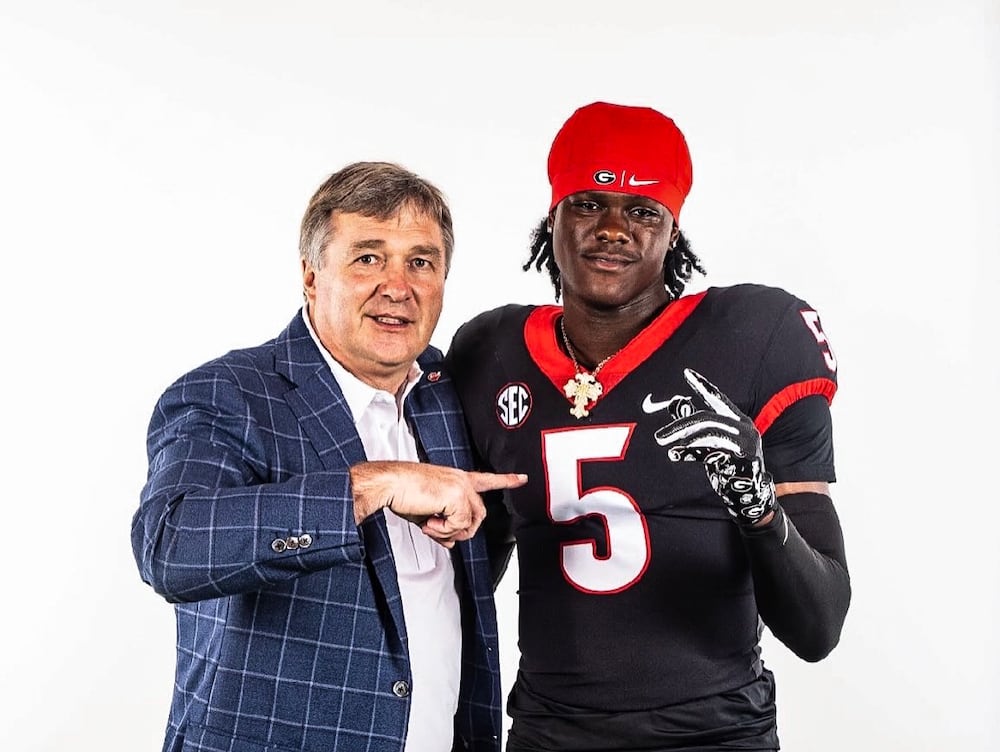 Georgia coach Kirby Smart (left) poses with Douglas County safety Adryan Cole, who committed to the Bulldogs on Saturday. (Courtesy photo)