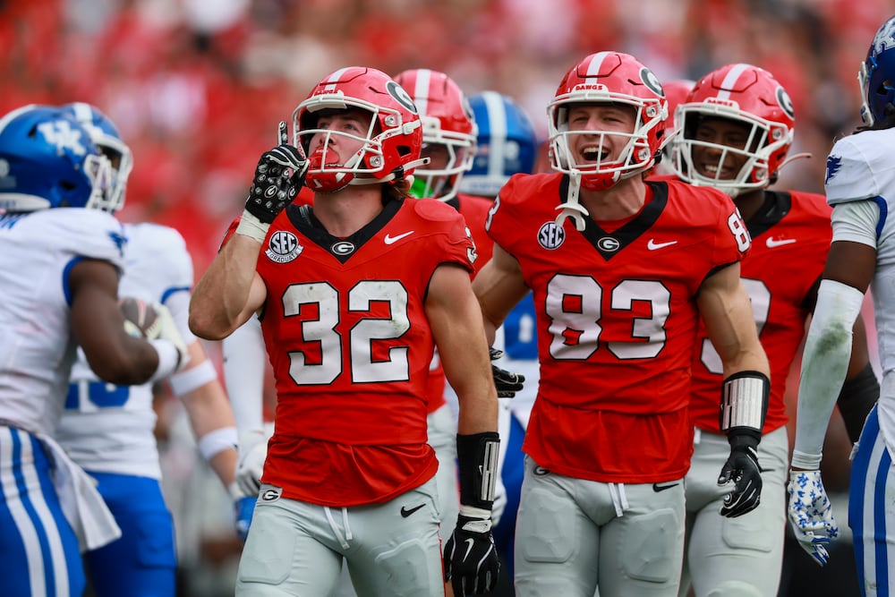 Georgia running back Cash Jones (left) celebrates a special teams tackle with wide receiver Cole Speer during their game against Kentucky at Sanford Stadium on Saturday, Oct. 4, 2025, in Athens. (Jason Getz/AJC)