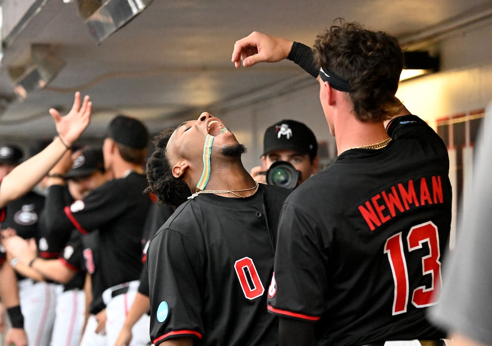 Georgia infielder Ryan Wynn (left) celebrates after hitting a two-run home run at Foley Field on Friday, May 29, 2026, in Athens. (Hyosub Shin/AJC)