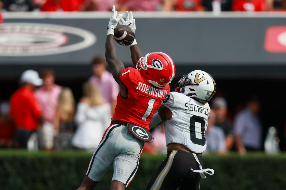 Georgia defensive back Ellis Robinson IV makes an interception on a pass intended for Vanderbilt wide receiver Junior Sherrill. (Jason Getz/AJC)