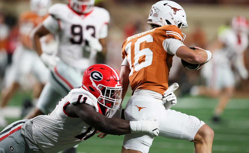 Georgia linebacker Jalon Walker, seen tackling Texas quarterback Arch Manning, had a big night against the Longhorns in 2024. (Jason Getz/AJC)