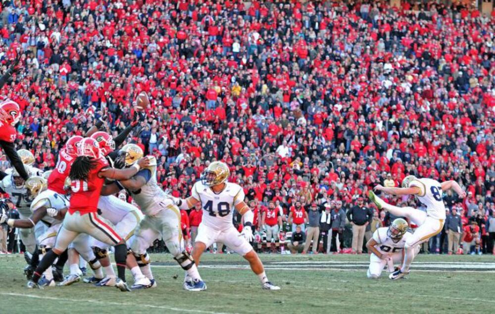 Georgia Tech kicker Harrison Butker hits a 53-yard field goal to tie the game at the end of regulation in 2014. (HYSOUB SHIN/AJC)