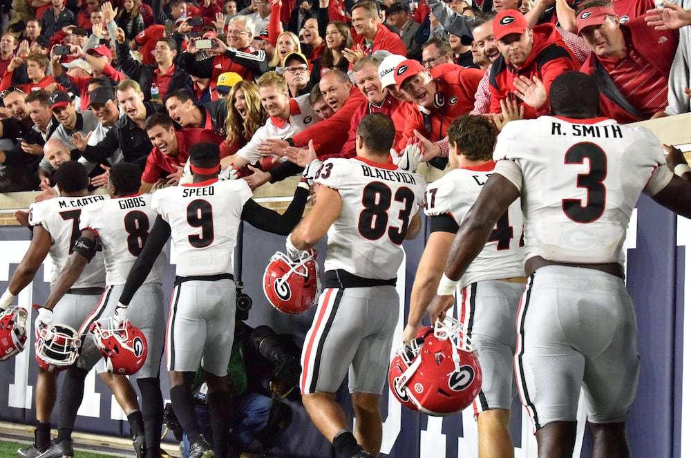 Georgia football players high-five fans after defeating the Fighting Irish, 20-19, at Notre Dame Stadium on Saturday, Sept. 9, 2017, in South Bend, Ind. (Courtesy of Perry McIntyre)
