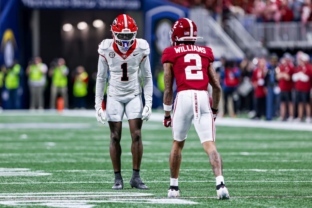 Georgia defensive back Ellis Robinson IV (left) lines up against Alabama wide receiver Ryan Coleman-Williams during the 2025 SEC championship game at Mercedes-Benz Stadium on Saturday, Dec. 6, 2025, in Atlanta. (Conor Dillon/UGAAA)