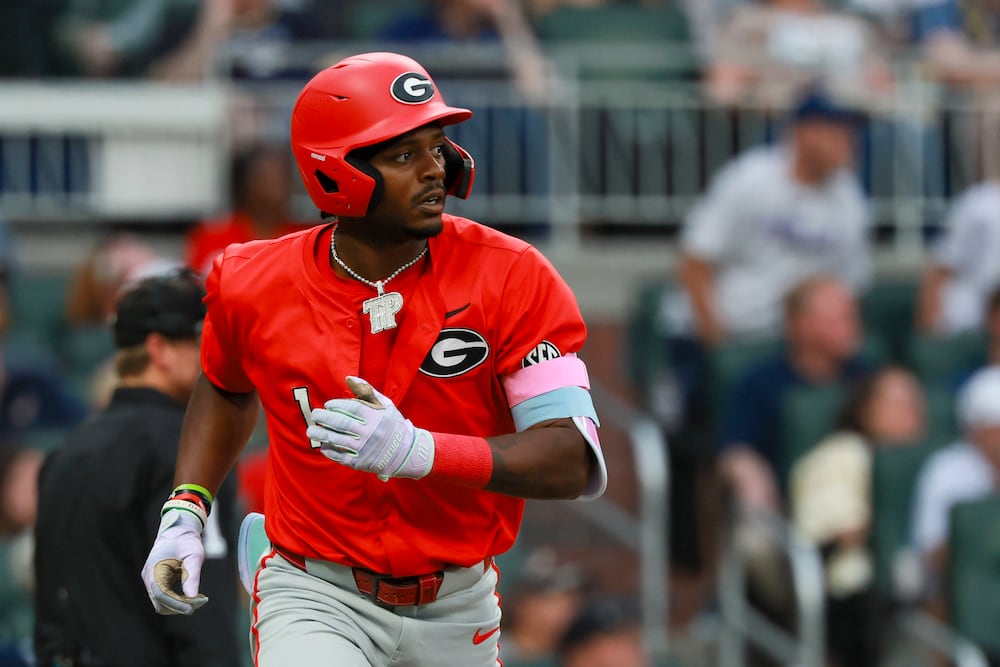 Georgia's Tre Phelps watches as he flies out to center field during the second inning against Georgia Tech on Tuesday, April 21, 2026, at Truist Park in Atlanta. (Jason Getz/AJC)