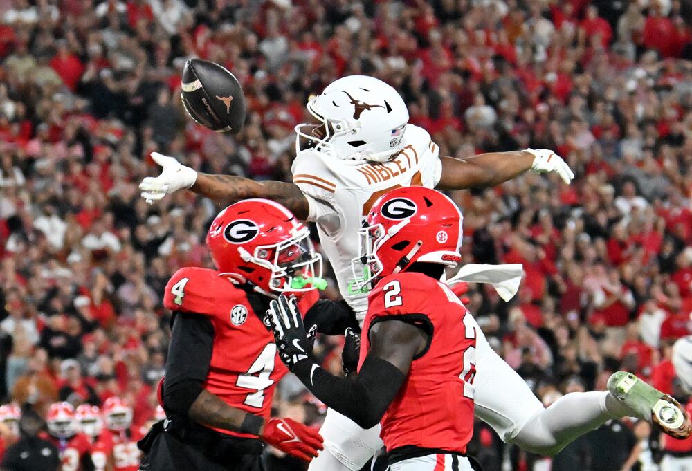 Texas wide receiver Ryan Niblett (center) is unable to catch under pressure from Georgia defensive back KJ Bolden (left) and safety Zion Branch at Sanford Stadium on Saturday, Nov. 15, 2025, in Athens. (Hyosub Shin/AJC)