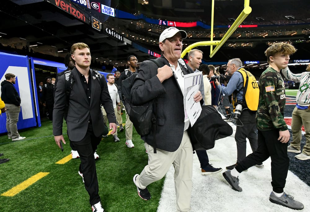 Georgia offensive coordinator Mike Bobo arrives with players and coaching staff before the Sugar Bowl against Ole Miss at the Caesars Superdome on Thursday, Jan. 1, 2026, in New Orleans. (Hyosub Shin/AJC)