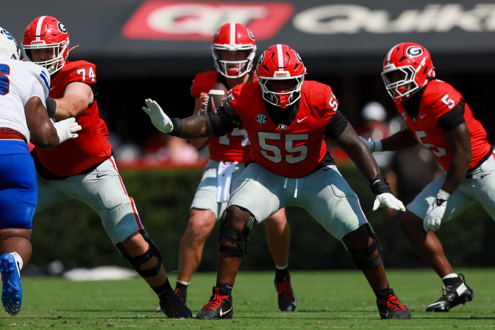 Georgia offensive lineman Zykie Helton (55) pass blocks for Georgia quarterback Gunner Stockton (14) during their game against Tennessee State at Sanford Stadium, Saturday, Sept. 5, 2026, in Athens, Ga. Georgia won 63-3. Jason Getz/AJC)