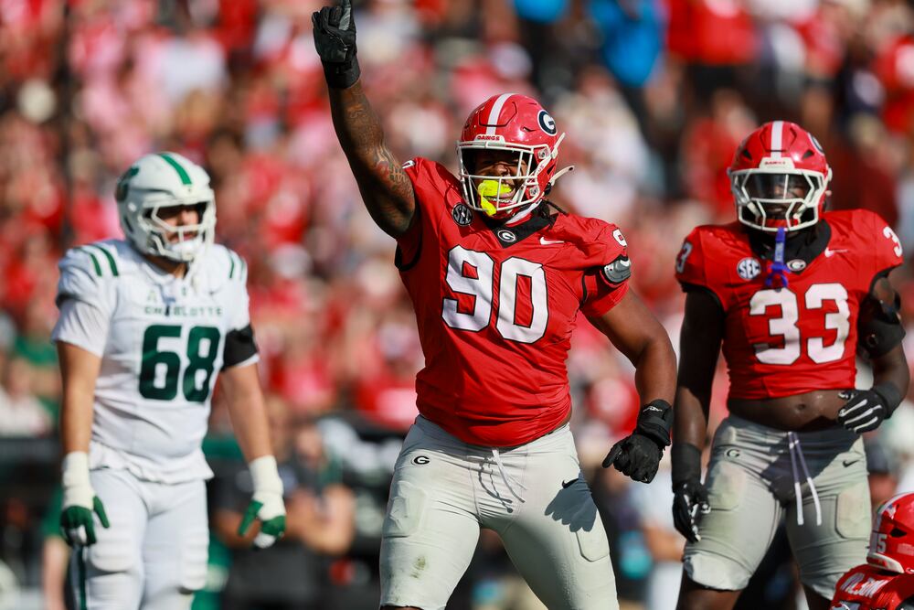 Georgia defensive lineman Elijah Griffin (90) reacts after sacking Charlotte quarterback Grayson Loftis (not pictured) during the second quarter in their NCAA game at Sanford Stadium, Friday, Nov. 22, 2025, in Athens, Ga. Georgia won 35-3. (Jason Getz / AJC)