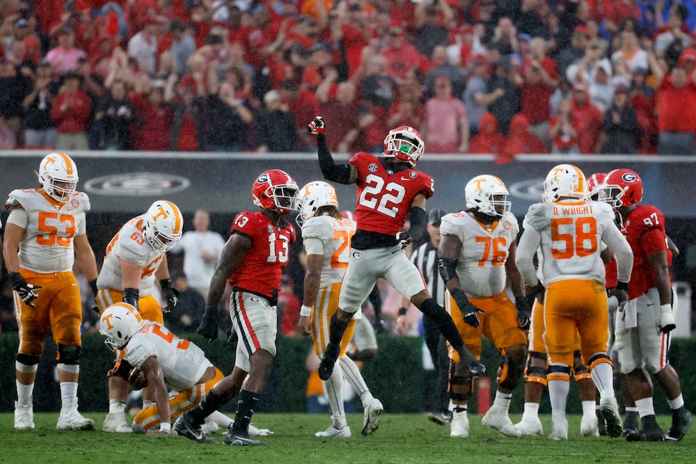 Bulldogs defensive back Javon Bullard (center) celebrates his sack of Volunteers quarterback Hendon Hooker at Sanford Stadium on Saturday, Nov. 5, 2022, in Athens. Georgia won, 27-13. (Jason Getz/AJC)