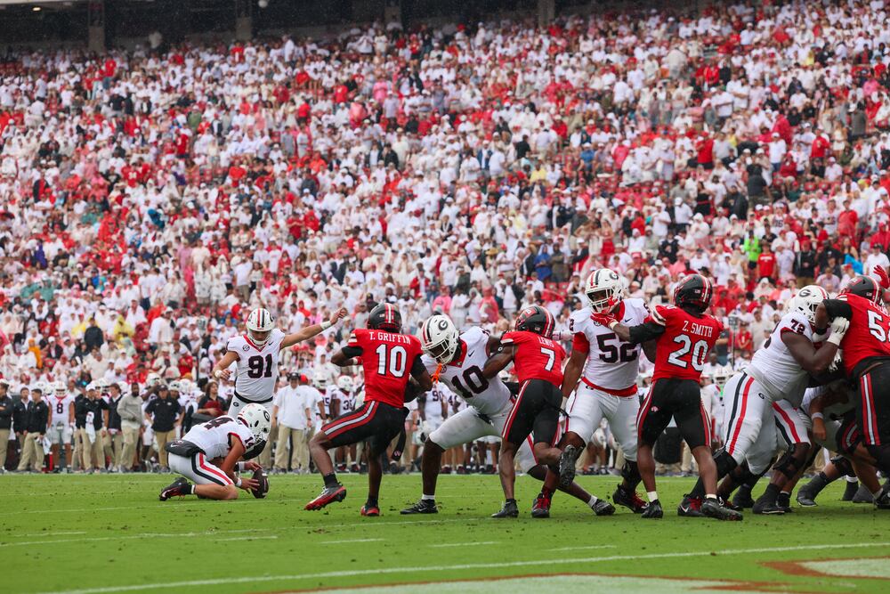 Georgia kicker Peyton Woodring (91) kicks an extra point after a Georgia touchdown during the first half against Western Kentucky in their NCAA football game at Sanford Stadium, Saturday, Sept. 12, 2026, in Athens, Ga. Georgia won 70-20. (Jason Getz/AJC)