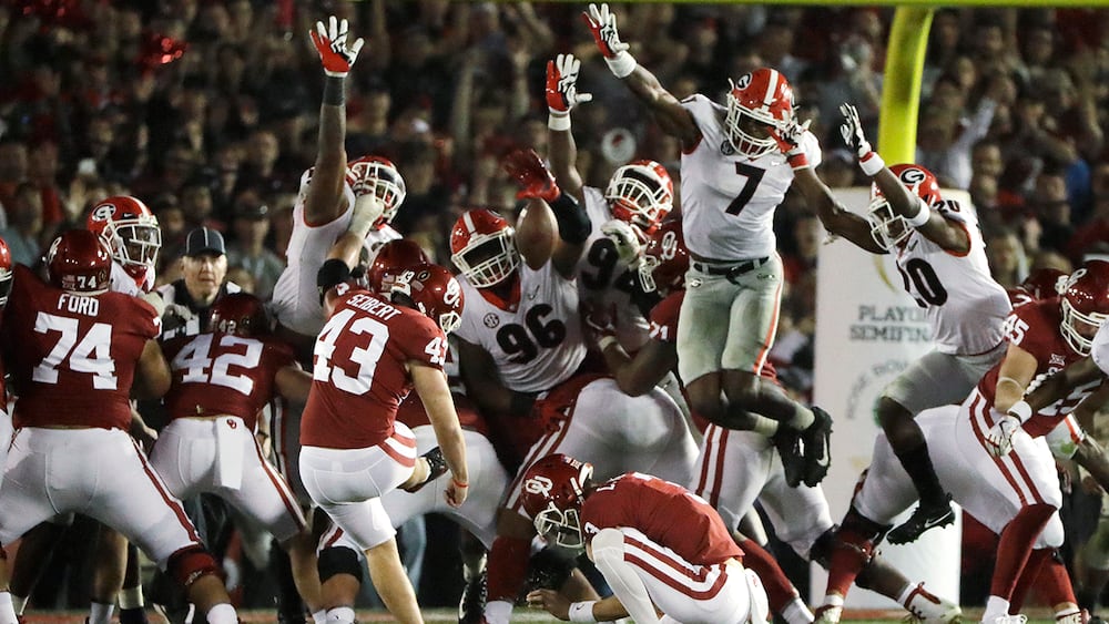 Georgia linebacker Lorenzo Carter (third from right) blocks a field goal attempt by Oklahoma kicker Austin Seibert during overtime in the Rose Bowl on Monday, Jan. 1, 2018, in Pasadena, Calif. (Gregory Bull/AP)
