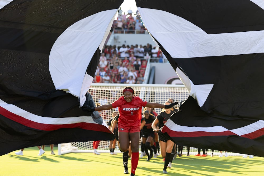 Georgia goalkeeper Jordan Brown leads the team through a banner before their "Soccer in Sanford" match against James Madison on Thursday, Aug. 20, 2026, at Sanford Stadium in Athens. (Evan Frilingos/The Red & Black via AP)