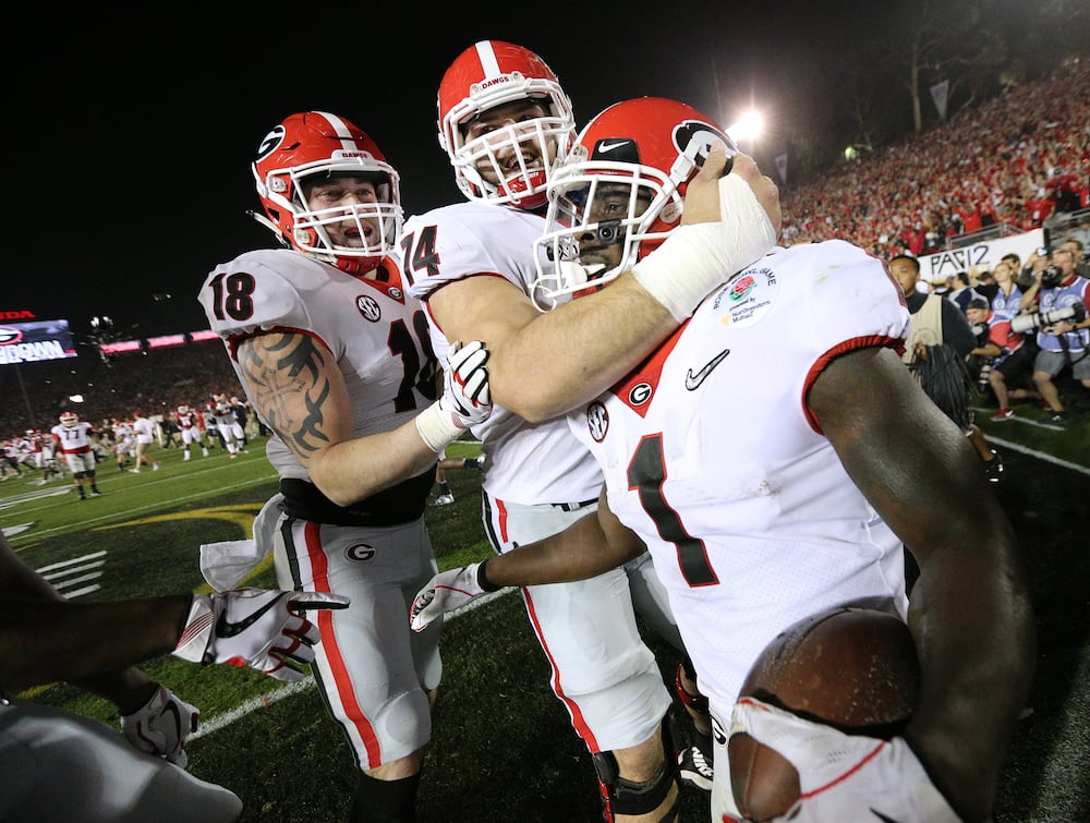 Georgia's Isaac Nauta (left) celebrates with Sony Michel (right) after Nauta sprung a block for Michel on the winning run of the Rose Bowl. (Curtis Compton/AJC 2018)
