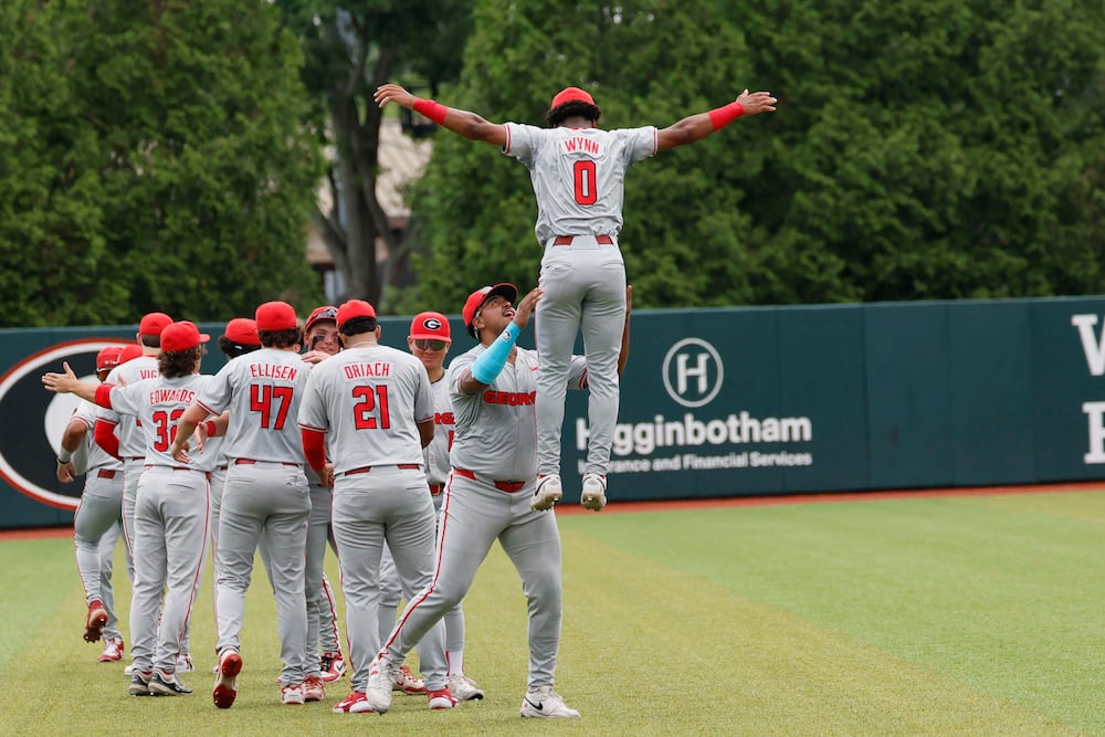 Georgia players gather in the outfield moments before they face Mississippi State for Game 2 of their NCAA Super Regional at Foley Field on Sunday, June 7, 2026, in Athens. (Miguel Martinez/AJC)