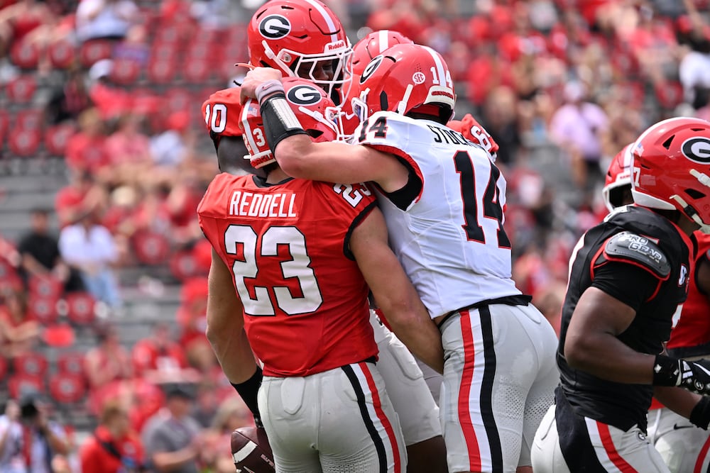 Georgia tight end Jaden Reddell (left) celebrates with teammates after scoring a touchdown during the G-Day spring football game at Sanford Stadium on Saturday, April 18, 2026, in Athens. (Hyosub Shin/AJC)