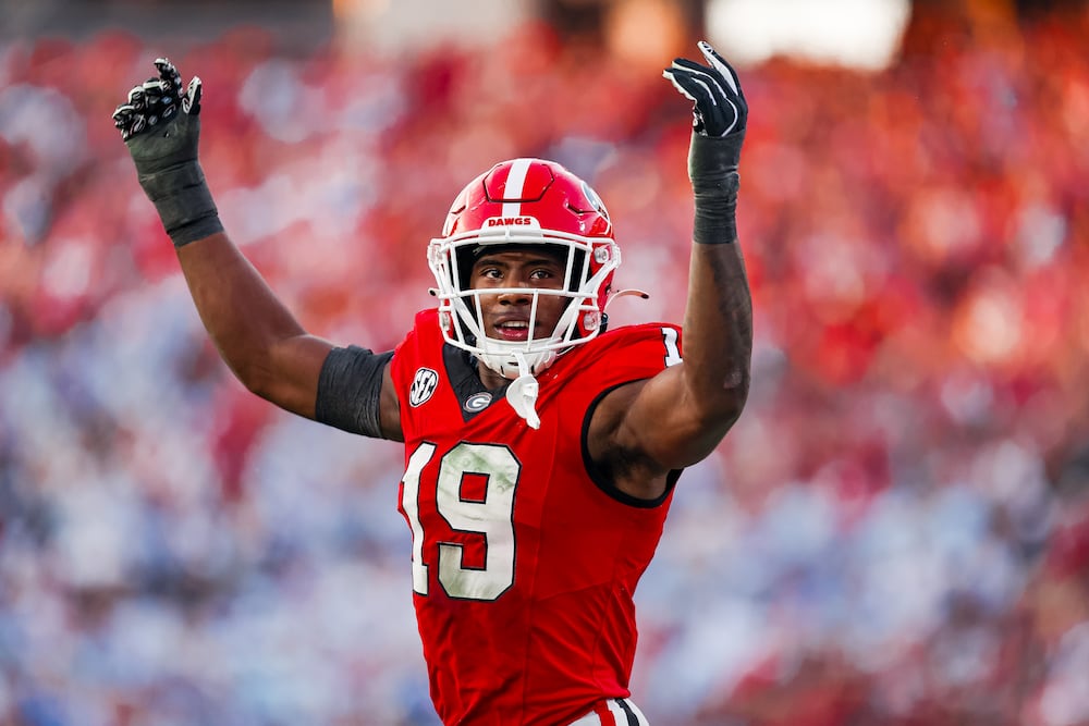 Georgia outside linebacker Justin Williams throws his arms up during the Bulldogs' game against Ole Miss at Sanford Stadium on Saturday, Oct. 18, 2025, in Athens. (Tony Walsh/UGAAA)
