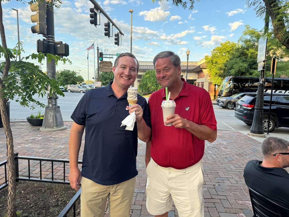 Brandon Adams (left) and Cody Chaffins eat ice cream at Dolci Old Market in Omaha, Nebraska, where they were in town to cover Georgia at the College World Series. (Sarah Spencer/AJC)