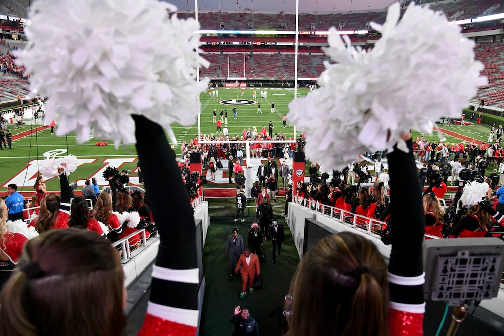 Georgia players and staff arrive during the Dawg Walk to their game against Texas at Sanford Stadium on Saturday, Nov. 15, 2025, in Athens. (Hyosub Shin/AJC)