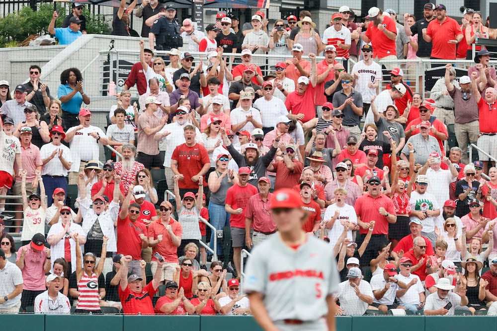 Georgia Bulldog fans react after pitcher Justin Byrd (5) strikes out a Mississippi State batter in the tenth inning of game 2 of the NCAA Super Regional at Foley Field on Sunday, June 7, 2026, in Athens. Miguel Martinez/AJC)