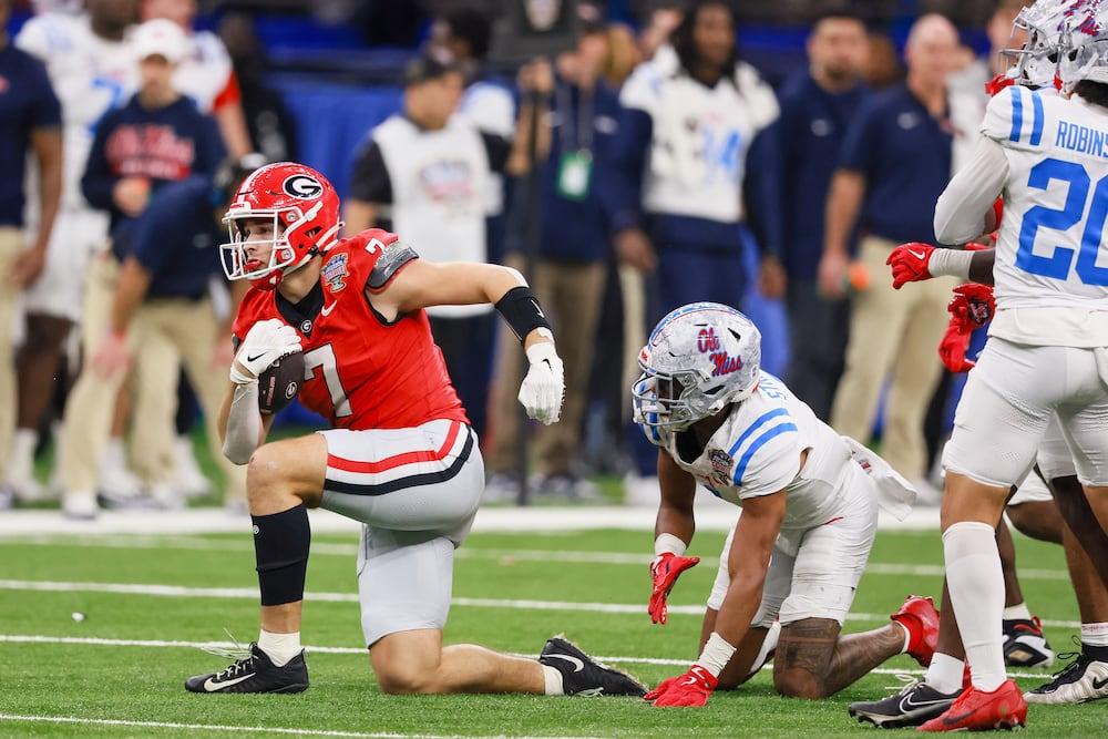 Georgia Bulldogs tight end Lawson Luckie (7) is stoped by the Ole Miss Rebels during the third quarter of the College Football Playoff quarterfinal game at the Sugar Bowl in the Caesars Superdome, Thursday, Jan. 1, 2026, in New Orleans. (Jason Getz/AJC)