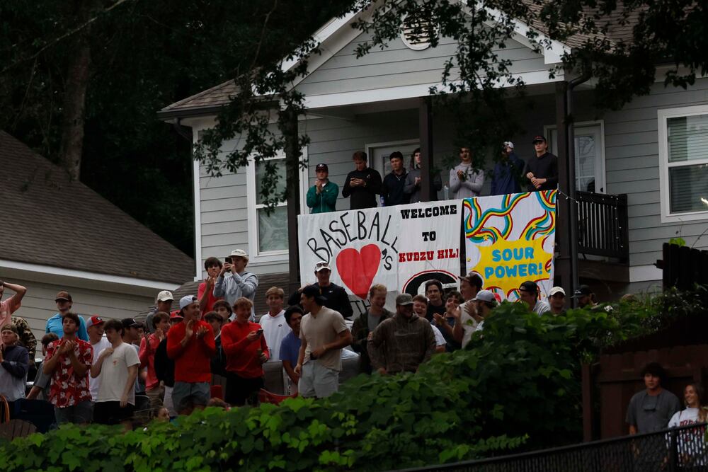  UGA fans cheer at Kudzu Hill after a home run by Georgia Bulldogs infielder Michael OShaughnessy (4) during the eighth inning of their NCAA Regional final game at Foley Field on Sunday, May 31, 2026, in Athens..(Miguel Martinez/AJC)