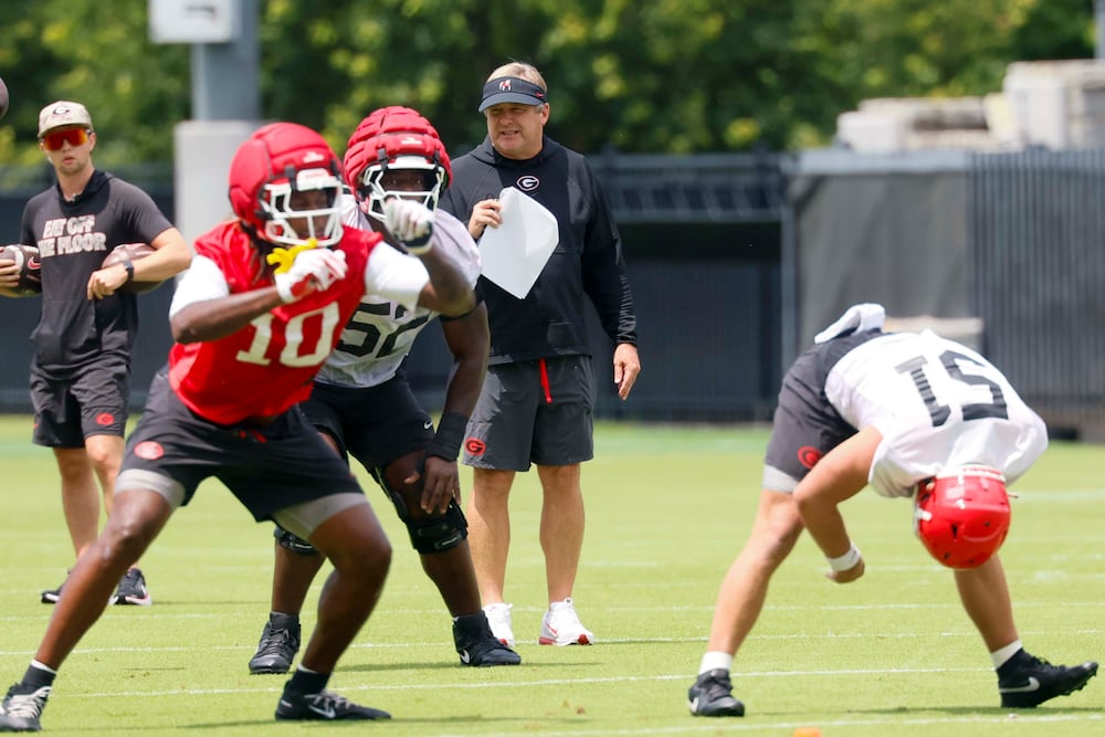 Georgia coach Kirby Smart (center, background) observes his team during the first fall football practice Wednesday, Aug. 5, 2026, at the practice facility in Athens. (Miguel Martinez/AJC)