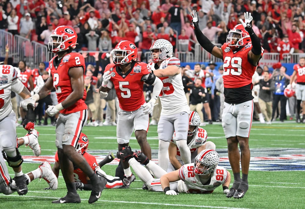 Ohio State place kicker Noah Ruggles remains on the ground after he is unable to score the final field goal of the Chick-fil-A Peach Bowl on Saturday, Dec. 31, 2022, in Atlanta. Georgia won, 42-41. (Hyosub Shin/AJC)