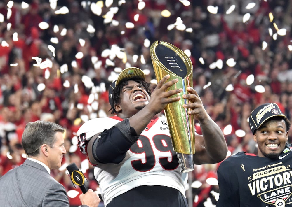 Georgia defensive lineman Jordan Davis celebrates their win over Alabama in the College Football Playoff national championship game at Lucas Oil Stadium on Monday, Jan. 10, 2022, in Indianapolis. (Hyosub Shin/AJC)